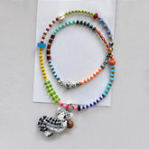 Colorful beaded necklaces with a tabby cat charm on a white background - verhalo jewelry