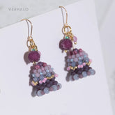 Pair of beaded blueberry cake earrings with purple and pink stones on a white background, branded 'VERHALO'.
