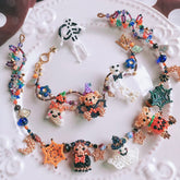 Colorful beaded Halloween jewelry set on a textured white surface - verhalo custom jewelry