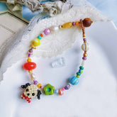 Colorful beaded puppy bracelet with decorative elements on a white surface - verhalo handmade jewelry