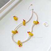 Necklace with 5-duck beaded charm on a white background