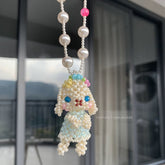 Pearl and bead Holland Lop Necklace, with a blurred background