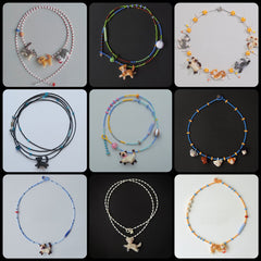 Collection of various beaded necklaces with cat charms on a black background
