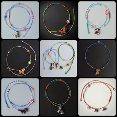 Collection of colorful beaded necklaces with various dog charms on a black background