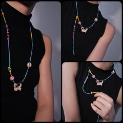 Colorful beaded necklace worn by a person on a plain background