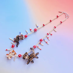 Handmade beaded necklace with three cats on a gradient background - verhalo jewelry