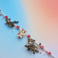 Handmade beaded necklace with three cats on a gradient background - verhalo custom jewelry