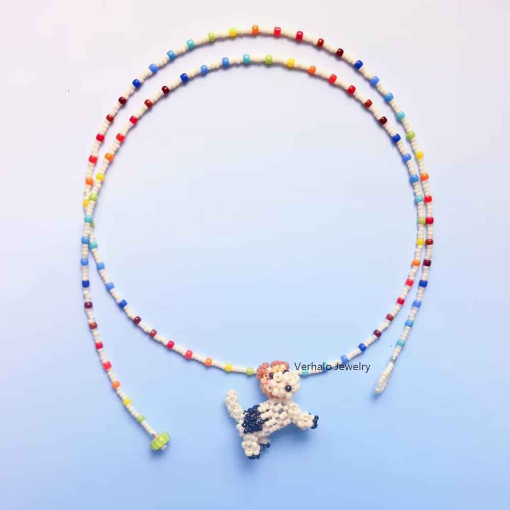 Colorful beaded necklace with a fox terrior dog pendant on a light blue background丨Verhalo丨Custom Jewelry
