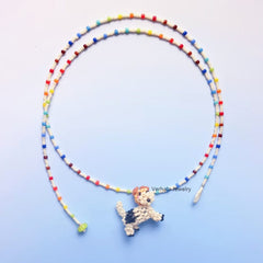 Colorful beaded necklace with a fox terrior dog pendant on a light blue background丨Verhalo丨Custom Jewelry