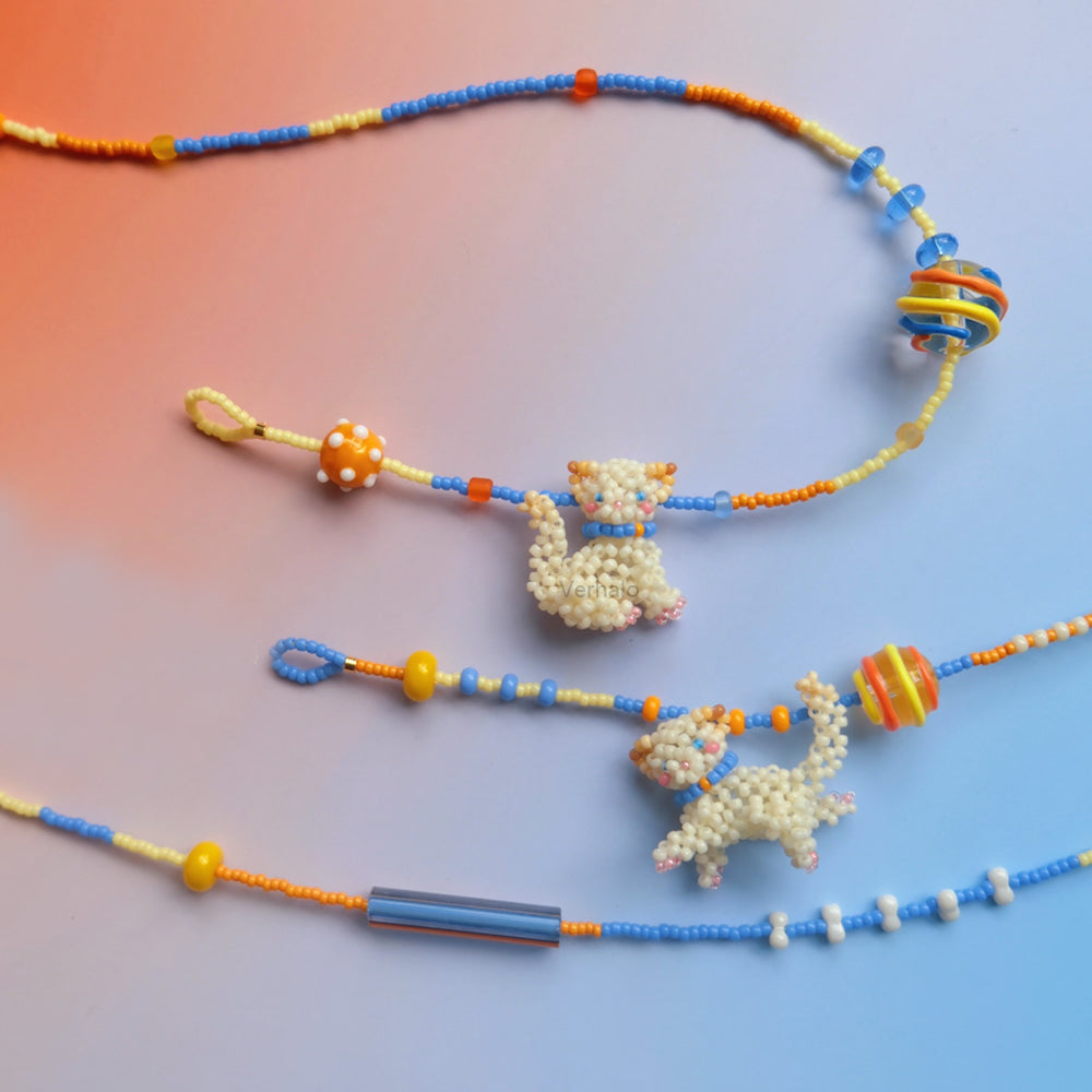 Colorful beaded necklaces & bracelet with cat pendants on a gradient background - verhalo custom jewelry