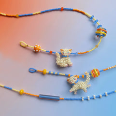 Colorful beaded necklaces & bracelet with cat pendants on a gradient background - verhalo custom jewelry