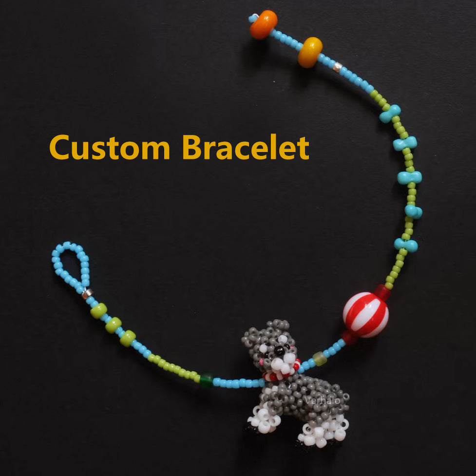 Custom bracelet with a dog charm on a black background - Verhalo handmade Jewelry