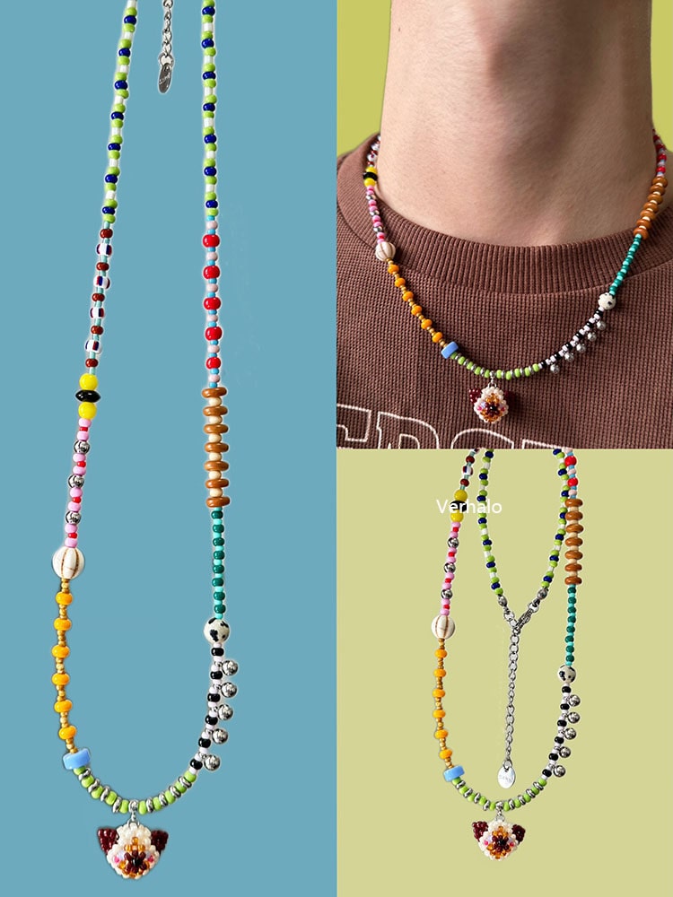 Colorful beaded necklaces with Siamese cat pendants on a blue and green background - Verhalo handmade jewelry