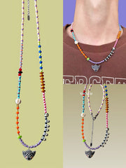 Colorful beaded necklaces with gray cat pendants on a person wearing a brown sweater. - Verhalo handmade jewelry
