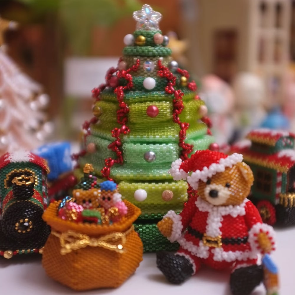 beaded Christmas tree with decorations and a Santa figure on a blurred background