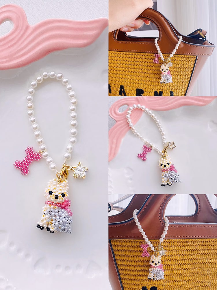 Pearl bag charm with Yorkie Dog charm on a white background