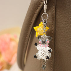 Beaded siamese cat  charm hanging on a leather surface - verhalo custom jewelry