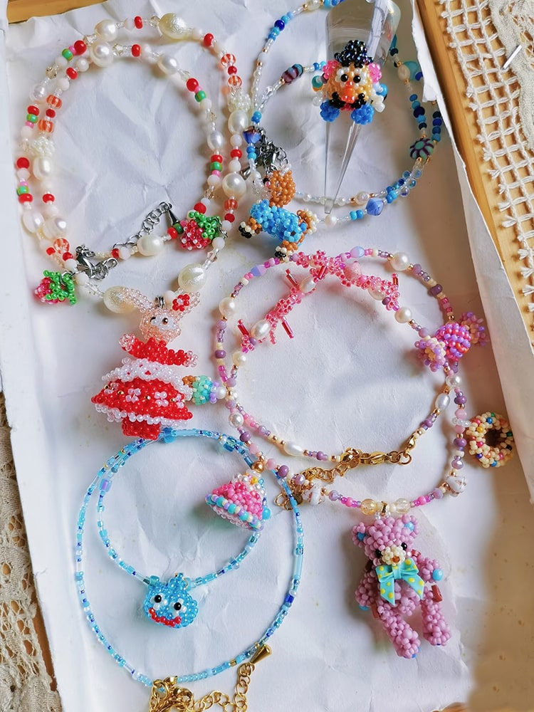Colorful beaded jewelry set on a white surface