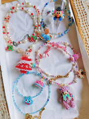 Colorful beaded jewelry set on a white surface