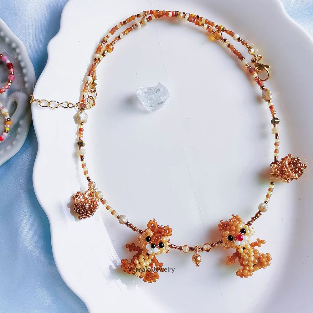 Necklace with squirrel  pendants on a white dish - verhalo custom jewelry