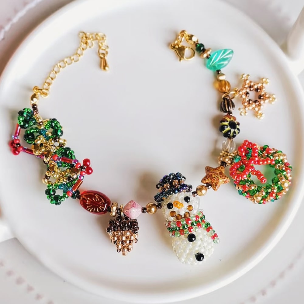 Colorful beaded snowman bracelet on a white plate