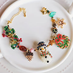 Colorful beaded snowman bracelet on a white plate