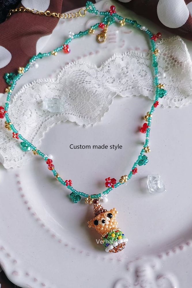 Beaded necklace with a custom-made style pendant on a lace background - verhalo custom jewelry