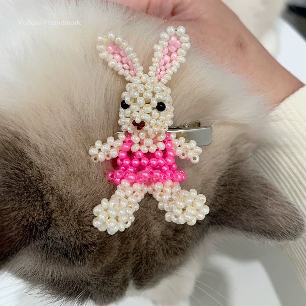 Beaded bunny hair clip on a cat's fur