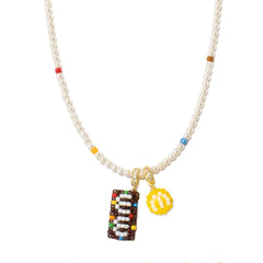 Necklace with colorful charm and letter 'M' on a white background