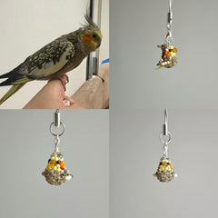 Collage of a cockatiel, a bird-shaped charm on a gray background.