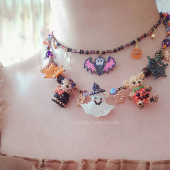 Halloween-themed beaded necklace with various characters on a person's neck.